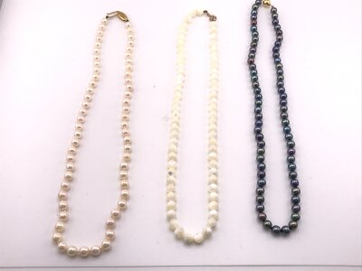 Three sets of pearls all with 9ct gold clasps