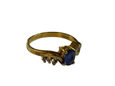 An 18ct yellow gold sapphire and diamond set ring, Size L.