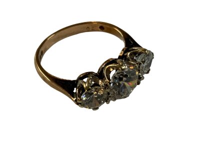 An impressive 3 stone trilogy ring, (CZ and 9ct) Size N.