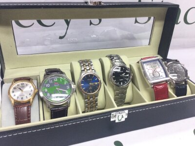Six various mens watches in case seen working
