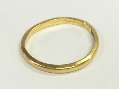 A 22ct gold wedding ring, size N, 2.85g total weight