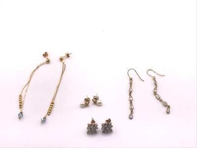 Two pairs of. 9ct gold earrings and a pair of earrings in form of stars set with CZ and one other pair.
