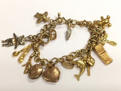 A 9ct gold charm bracelet, 22.9g total weight