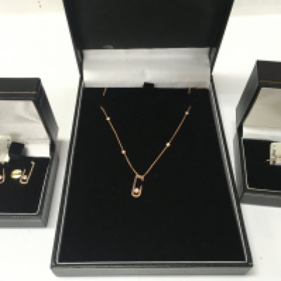 A 14ct rose gold and diamond jewellery suite. Ring size N