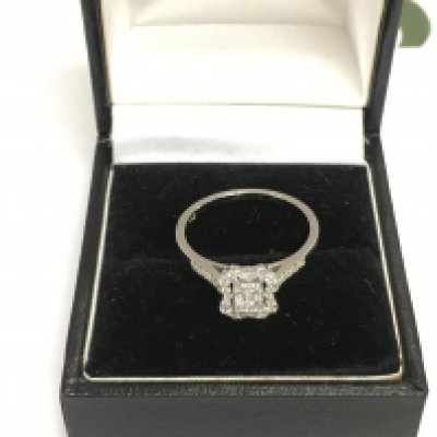 A 14ct white gold diamond cluster ring, approx 2.1g and approx size M-N. Shipping category A.