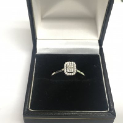 A 14ct white gold diamond cluster ring, approx 1.7g and approx size M-N. Shipping category A.