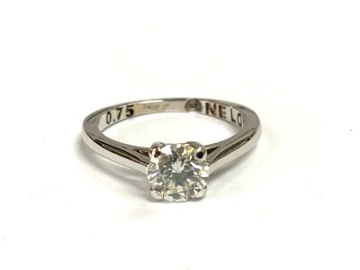 An 18ct white gold diamond solitare ring, 0.75ct, Size K.