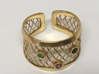 An 18carat gold ring open weave pattern set with ruby emerald and sapphire weight 3.9g ring size S+