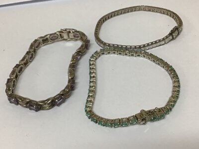 Three Silver bracelets set with amethyst CZ and pale blue stones. Weight 40g