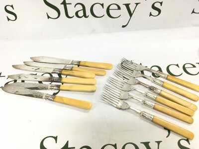 Six silver plated knives and six forks with silver hallmarked collars