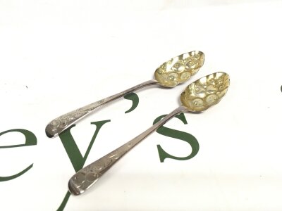 Two small silver hallmarked berry spoons,  31g total weight