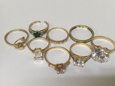 A collection of 585 14carat gold rings set with CZ other coloured stones one with a cut shank total weight 25g