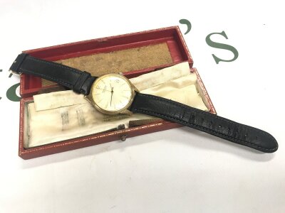 A 9 carat gold cased Garrard watch, seen working. 37g total weight