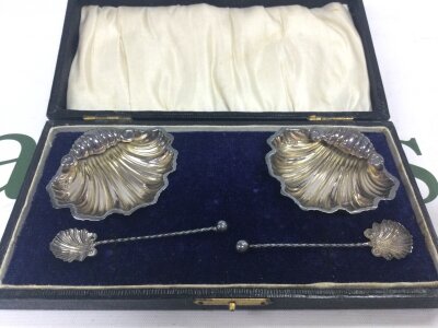 A cased pair of silver hallmarked salt cellars, total weight 25g