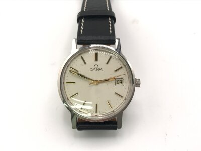 An omega manual wind stainless case oyster face. Circa 1970s with aftermarket black leather strap.