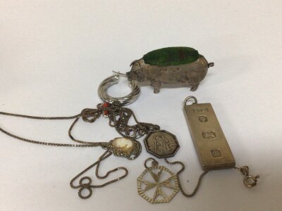 A collection of silver oddments a silver pendent pig pin Cushion necklace and a single earring.weight 52g
