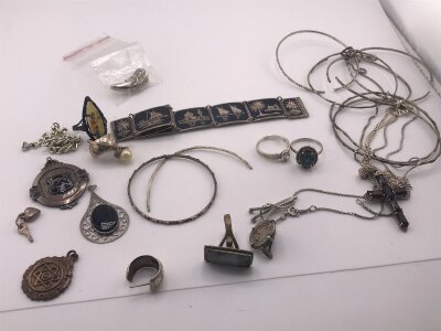 A Collection of silver costume jewellery including bracelets and pendants.