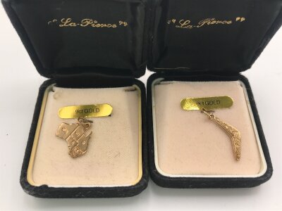 Two 9ct gold charms.