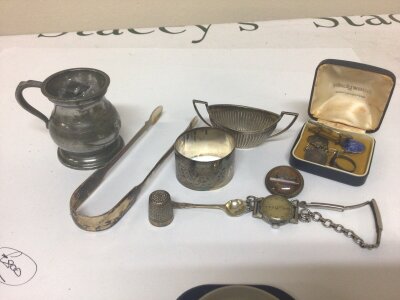 A silver napkin ring silver salt, a pair of George III silver sugar tongs and other oddments silver weight 82g approximately.