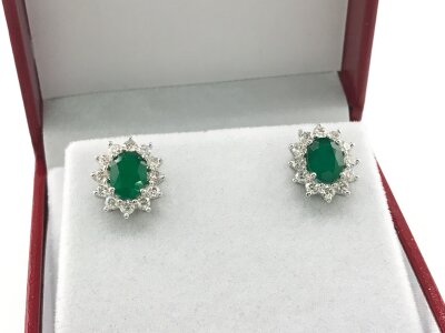 18ct white gold oval emerald and diamond cluster studs. Emeralds approx 2.25ct and 1.09ct diamonds.