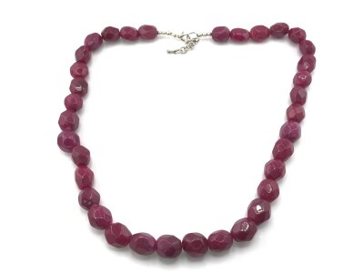 A necklace strung with large polished reconstructed Ruby beads. Approximately 408ct