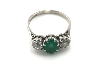 An 18ct white gold oval emerald and diamond multi claw set trilogy ring. Emerald 1.37ct and 0.85ct diamond approximately. 
Size P