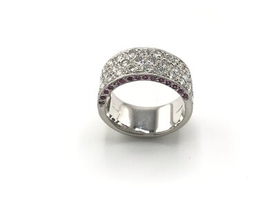 Platinum diamond set band with pink sapphires set to each side. Approx 1.50ct diamonds and 0.30ct sapphires.
Size N 1/2