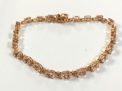 A 9ct rose gold morganite tennis bracelet, 8g total weight.