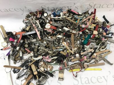 A large collection of various fashion watches