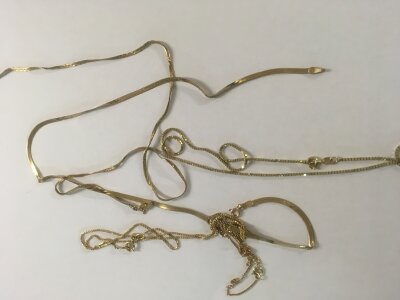 A Collection of 9 ct  Necklaces 12 grams Approx.