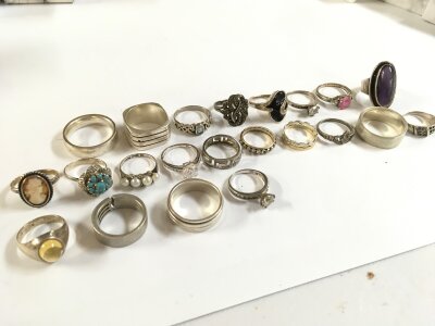 A good collection of silver rings of various designs. 110g total weight approximately