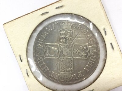 A queen Ann 1708 half crown.