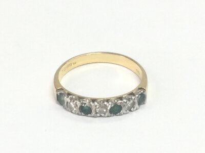 An 18ct gold emerald and diamond ring size N and 2.72g