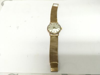 A 9ct gents Tissot watch both strap and case 9ct.