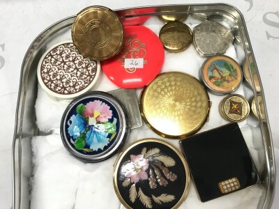 A collection of vintage compacts, enamels, pill boxes
