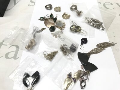 20 pairs of silver earrings and bigger silver earrings