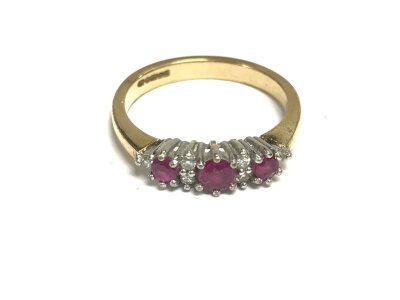 A 9ct gold ring set with rubies. Size N and 2.74g