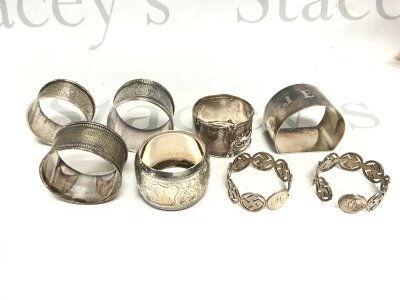 A collection of various silver napkin rings. Approximately 168g