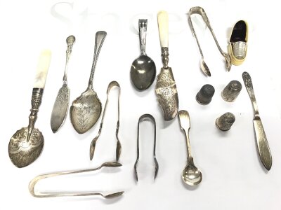A collection of silver spoons, sugar tongs thimbles etc
Approximately 200g