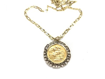 A 1915 full sovereign mounted in 9ct gold pendant on 9ct gold chain. Total 25.01g