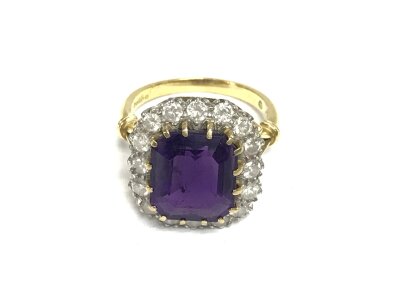 An 18ct gold amethyst and diamond cluster dress ring. Size O and 7.31g