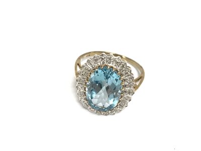 A 9ct gold diamond and pale topaz dress ring size P and 4.60g