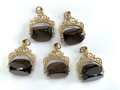 5 9ct gold and Smokey quartz fobs.