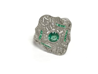 Platinum art deco style ornate dress ring set with emeralds and diamonds. Approx 0.43ct emeralds. Size O