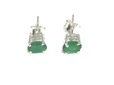 A pair of silver emerald stud earrings.