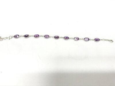 A silver line bracelet set with oval amethysts approx 8ct and 20cm length