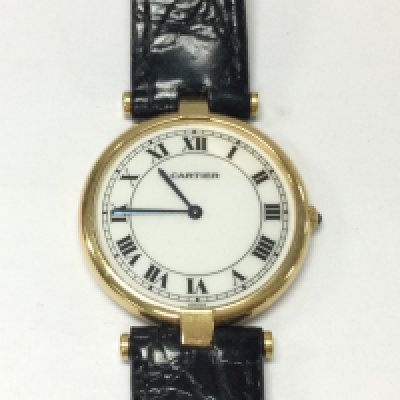 An 18ct Cartier Panthere vendome watch with black leather strap. Quartz movement seen running