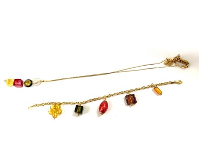 A 9ct gold Italian charm bracelet with a matching 9ct gold necklace.