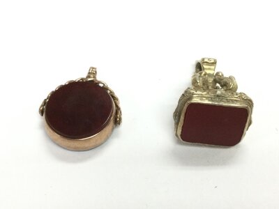 A 9ct gold bloodstone fob and a gilt metal fob.