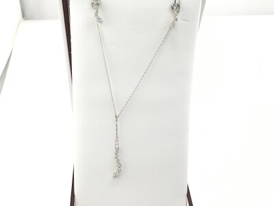 A 10ct white gold necklace with pendant and matching earring.
2.70g